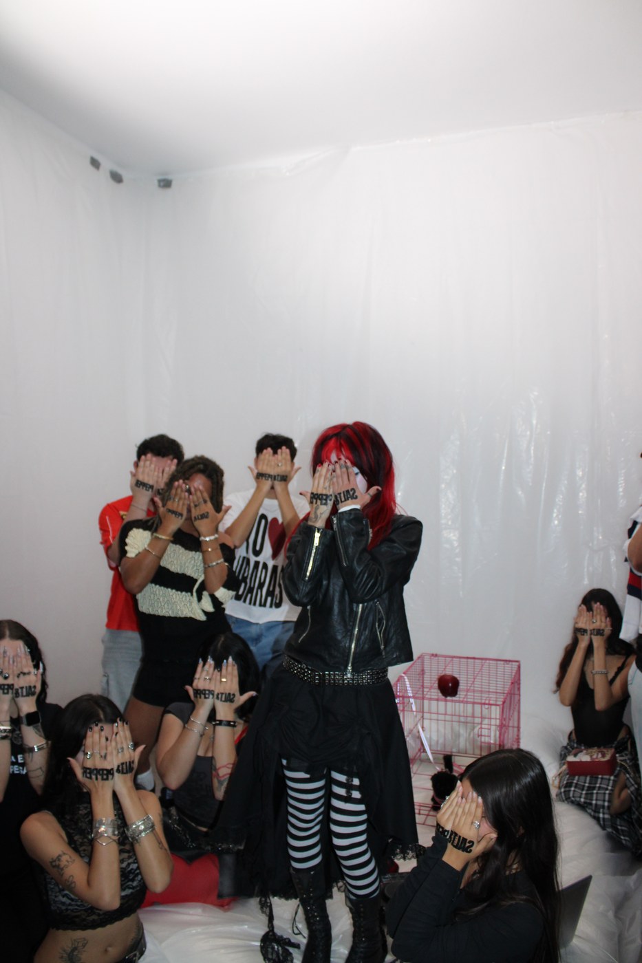 Melodie and fans covering their faces with SALT and PEPPER hand tattoos.